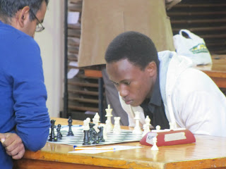 Patrick Kawuma in action against Amit Dodhia.