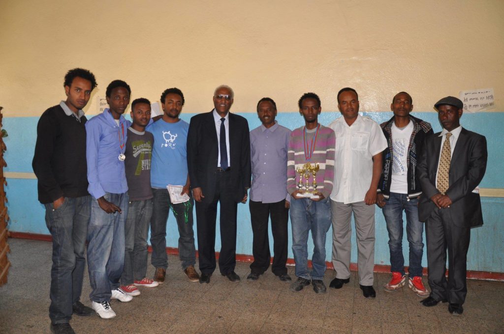 From left Lilay, Samuel, Amanuel, Adam, Delegate of Ministry Sport ,Mr Semere President of Eritrea Chess Federation, Kibrom holding trophy ,Napoleon, Biniam and Ahmed.  Photo during the 2015 Eritrea National Championship