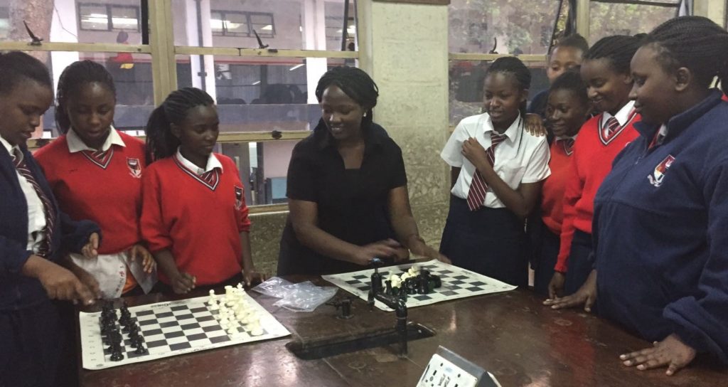 Joyce Nyaruai Introduces the game to the girls.