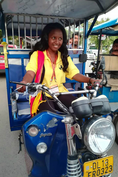 WFM Christine Namaganda on a rickshaw.