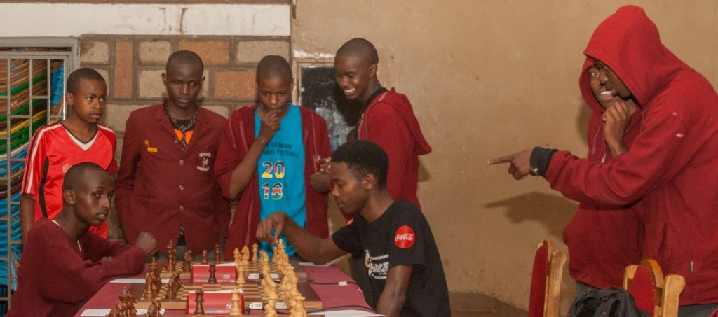 Boys from Meru School get a feel for world class technology with the DGT Board provided by Terrian Chess Academy. Photo credit Eastmond Mwendia.