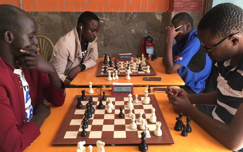 James Panchol (left) takes on Joseph Atwoli.  Photo credit Terrian Chess Academy.