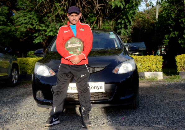 Mehul Gohil poses with the car he won when he was crowned 2019 Kenya National Chess Champion. Photo credit Kim Bhari.