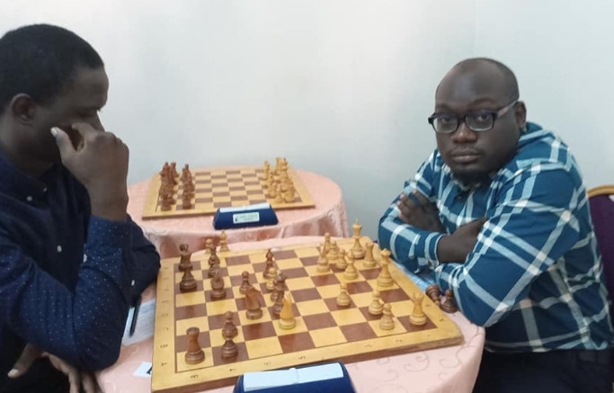 IM Arthur Ssegwanyi (right) in action during the 2019 Kireka Open. Photo credit Pearl Chess Academy.