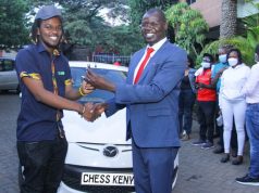 Chess Champion – Martin Njoroge receives the keys to the car that he won. Photo credit Oliver Ananda .