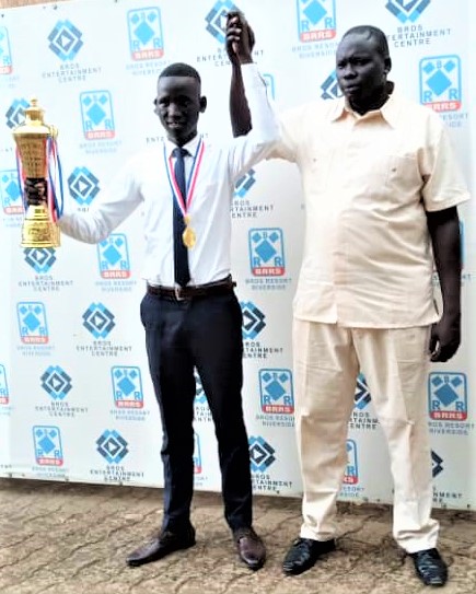 Gong Thon Gong (left) poses with his trophy for winning the 1st phase of the Olympiad Qualifiers.