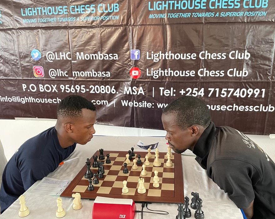 Limbikani Chitundu (left) takes on Michael Mawanda in their round 4 encounter which ended for a win for black.
