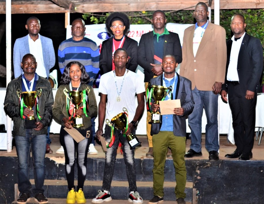 Prize winners and officials pose for a group photo. Standing in front with their trophies - From left Steve Khota (Veterans), Daisederata Nkhoma (Ladies), Gracious Maseya (Youth) and overall winner George Mwale.