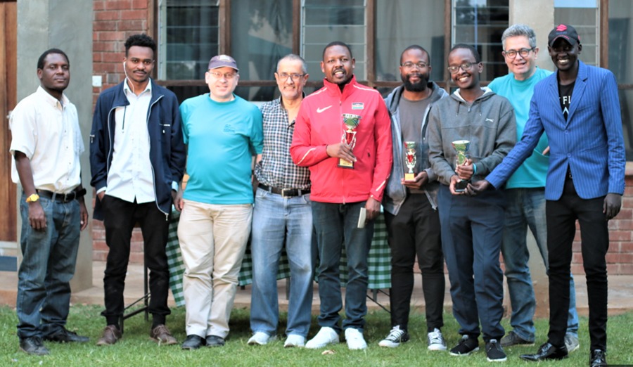 Happy prize winners in the Open Section pose for a group photo. From left IA Duke Michieka, Felxi Boera, Warren Pollock, Kim Bhari, Ricky Sang, Trevor Mulindi, Ian Mutugi, Willy Simons and James Panchol.