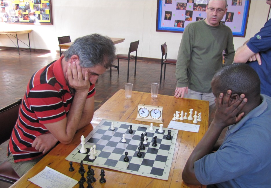 Mushfig Habilov (left) against Tom Okongo while Warren Pollock looks on.