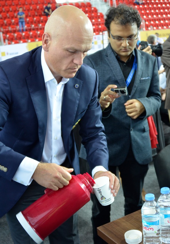 Andrey Filatov makes some coffee for his team during the 2018 Batumi Olympiad with Sagar Shah carefully recording the process.  Photo credit Kim Bhari.