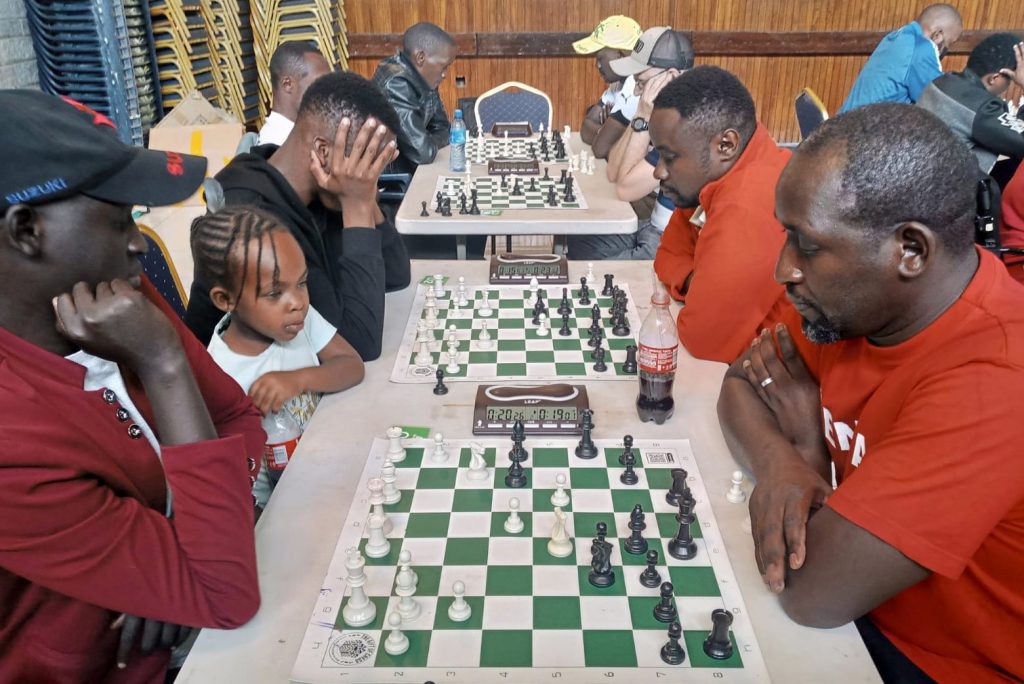 James Panchol (left) versus Dr Victor Ng'ani during their round 5 encounter.