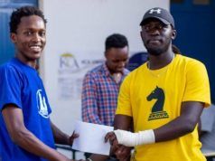 Zadock Nyakundi (left) receives his prize from Ronald Bolo.