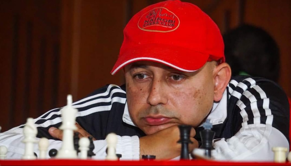 The defending Champion Mehul Gohil in action proudly wearing his Nairobi Chess Club cap. Photo credit Isaac Pelnino.