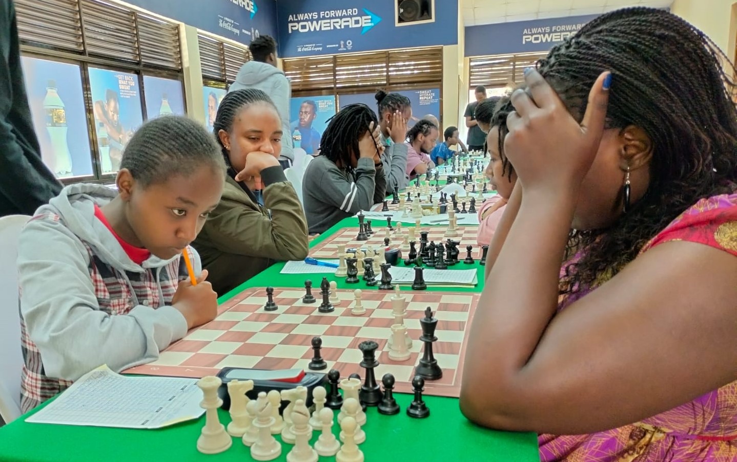 Elizabeth Cassidy (left) playing against WCM Joyce Nyaruai who had to dig deep to defeat her stubborn and young opponent.